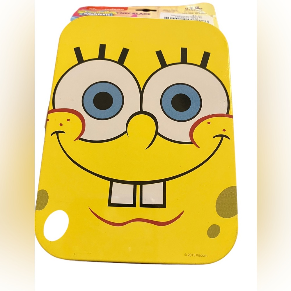 SpongeBob SquarePants collectible tin with SpongeBob charm on necklace.